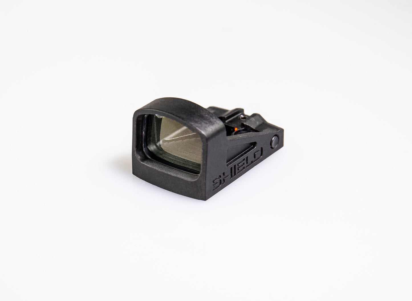 black red dot sight showing glass