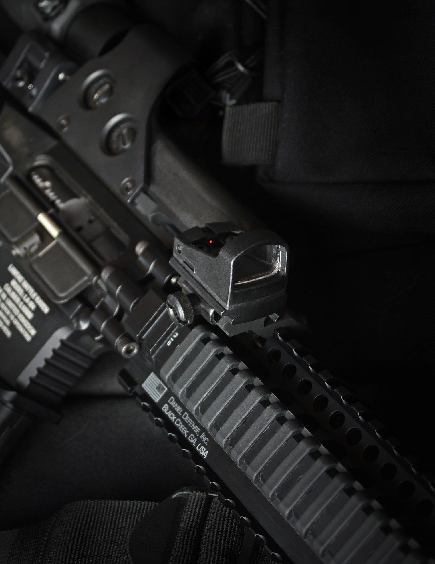 black red dot mounted on AR style rifle